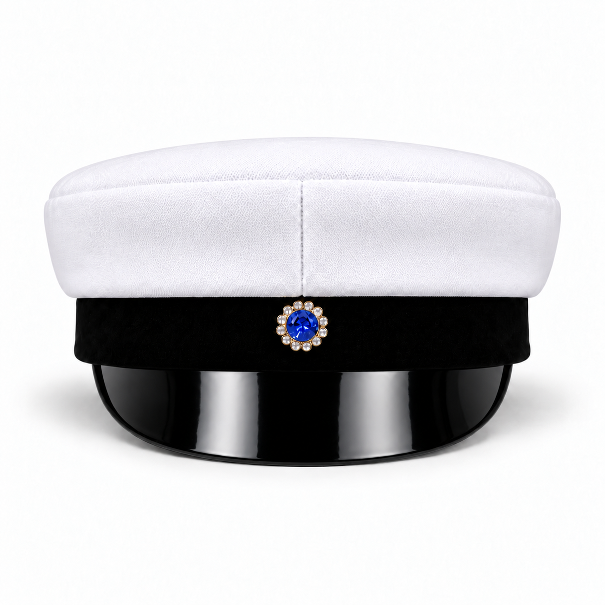 Swedish graduation cap, front view showing the blue-centred badge and glossy black visor