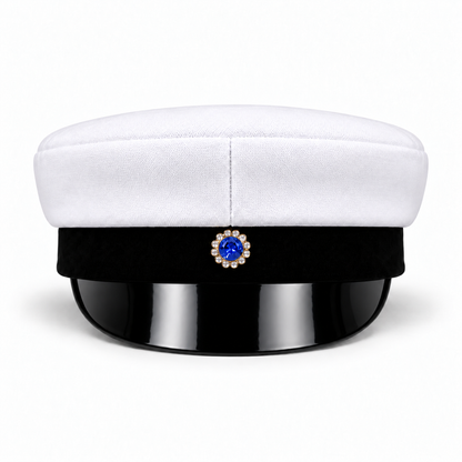 Swedish graduation cap, front view showing the blue-centred badge and glossy black visor